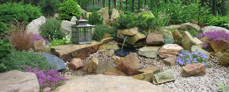 Unique landscaping with stone flower garden